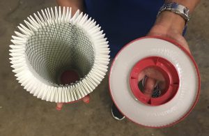 A brand new CDCLarue® Pulse-Bac® filter showing wider portion of the base not completely "potted" into the epoxy, resulting in filter pleats not fully sealed during use.  Has this happened to you?